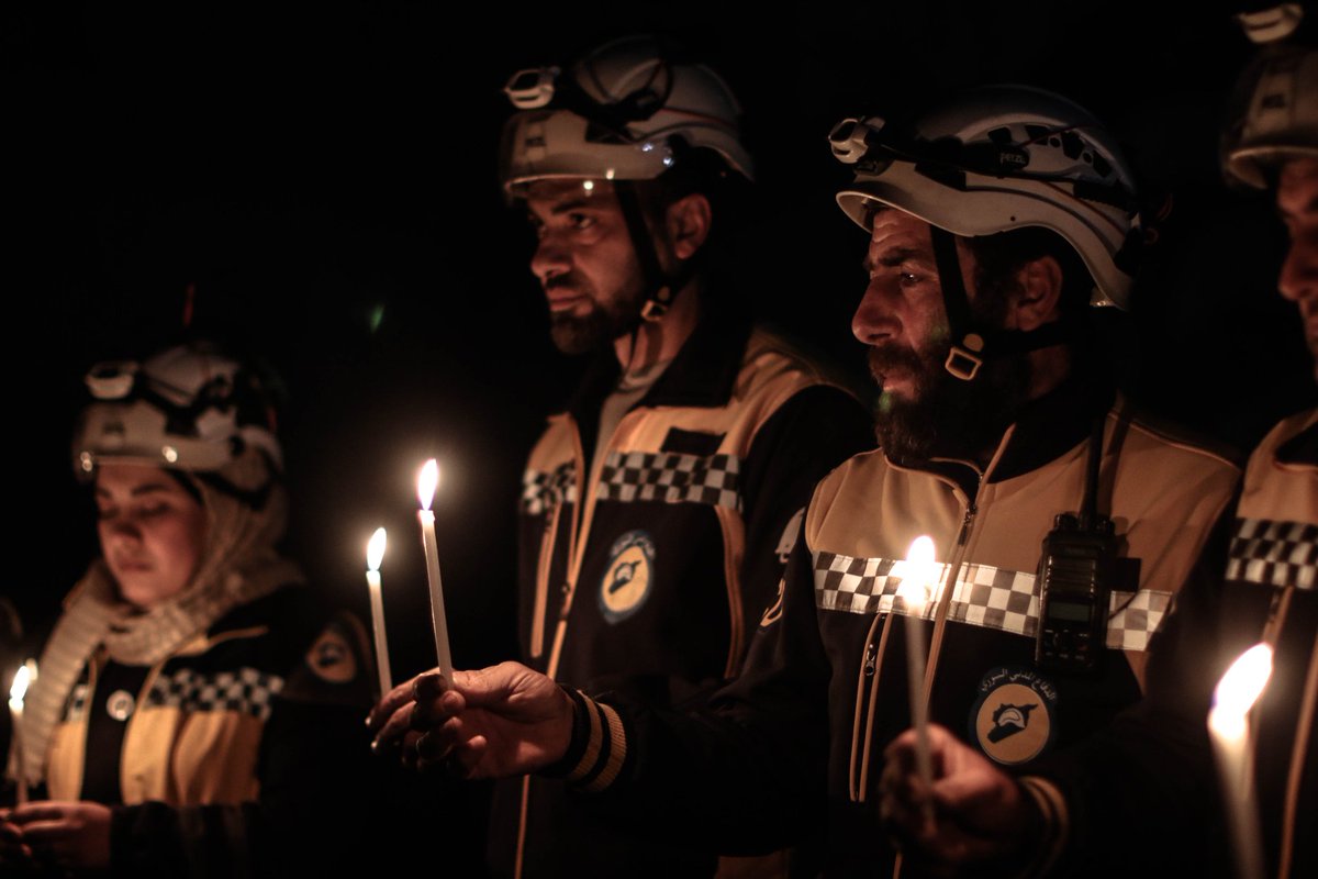 the White Helmets team lighting candles